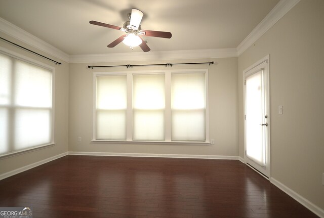 1142 Terrasol Rdg SW, Lilburn, GA 30047 - spare room featuring ceiling fan, baseboards, ornamental molding, and dark wood-style floors