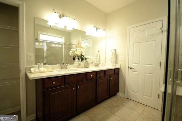 1142 Terrasol Rdg SW, Lilburn, GA 30047 - full bathroom with double vanity, tile patterned floors, a stall shower, and a sink