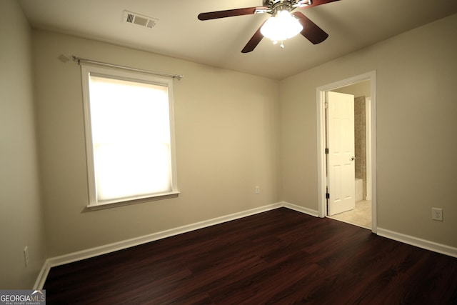1142 Terrasol Rdg SW, Lilburn, GA 30047 - empty room featuring wood finished floors, visible vents, a ceiling fan, and baseboards