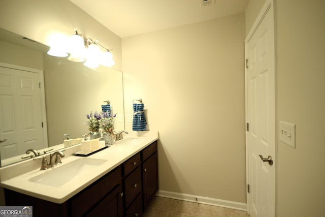 1142 Terrasol Rdg SW, Lilburn, GA 30047 - full bathroom featuring tile patterned floors, baseboards, a sink, and double vanity