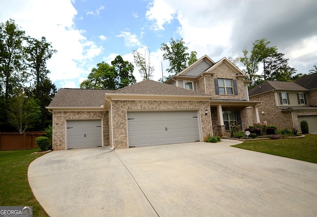 1142 Terrasol Rdg SW, Lilburn, GA 30047 - craftsman inspired home featuring an attached garage, brick siding, a front yard, and concrete driveway