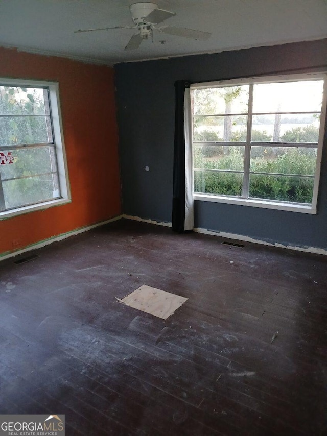 745 Harmony Church Rd, Colquitt, GA 39837 - unfurnished room with wood-type flooring and ceiling fan
