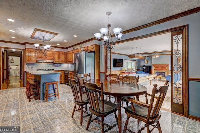 171 Wynn Dr, Hampton, GA 30228 - dining area with crown molding, recessed lighting, a textured ceiling, and a chandelier
