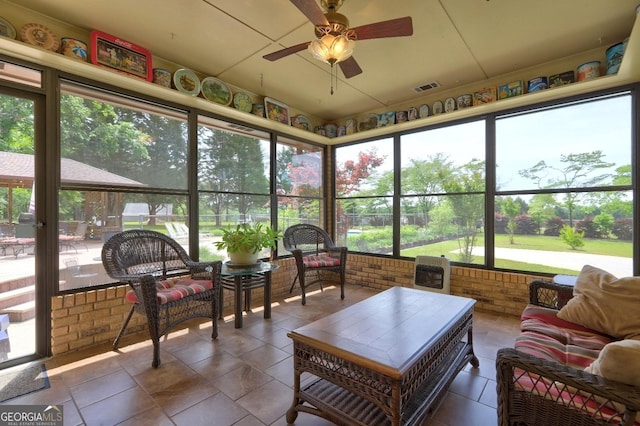 171 Wynn Dr, Hampton, GA 30228 - sunroom featuring ceiling fan, visible vents, and outdoor lounge area