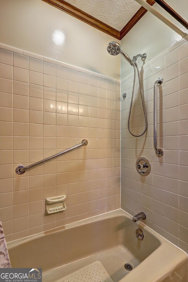 171 Wynn Dr, Hampton, GA 30228 - bathroom featuring shower / bathtub combination with curtain and ornamental molding