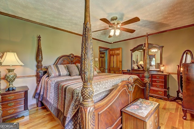 171 Wynn Dr, Hampton, GA 30228 - bedroom featuring a textured ceiling, ornamental molding, ceiling fan, and light wood-style floors