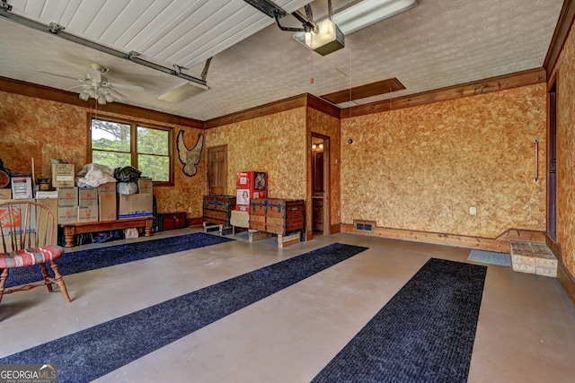 171 Wynn Dr, Hampton, GA 30228 - garage with a garage door opener and ceiling fan