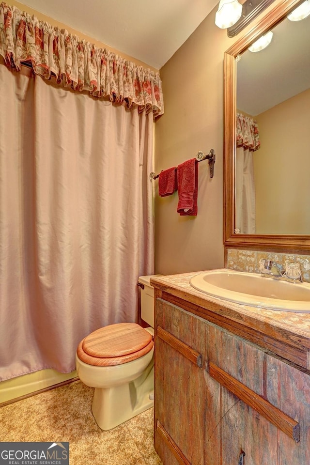 171 Wynn Dr, Hampton, GA 30228 - bathroom featuring vanity, curtained shower, and toilet