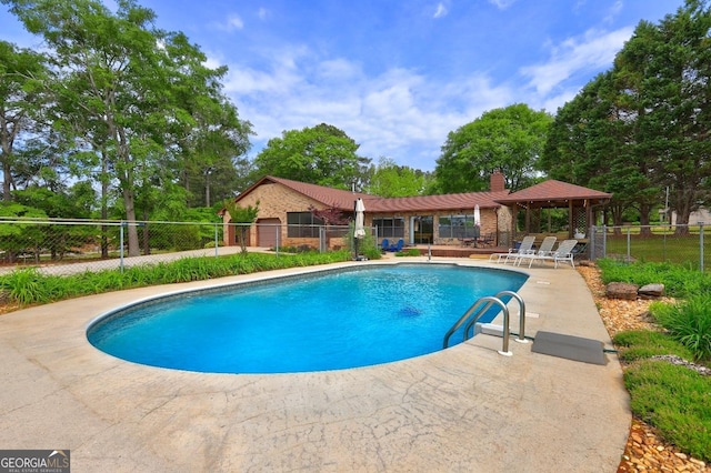 171 Wynn Dr, Hampton, GA 30228 - view of pool featuring a patio area and view of scattered trees