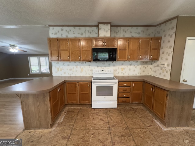 492 Garmon Rd, Cedartown, GA 30125 - kitchen featuring wallpapered walls, a textured ceiling, white electric stove, black microwave, and a peninsula