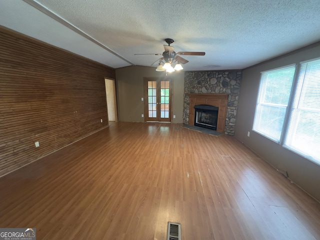 492 Garmon Rd, Cedartown, GA 30125 - unfurnished living room featuring a textured ceiling, visible vents, ceiling fan, and light wood-style floors