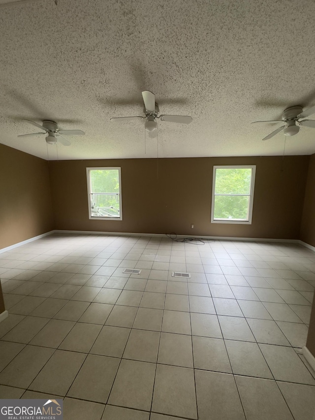 492 Garmon Rd, Cedartown, GA 30125 - unfurnished room with baseboards, a ceiling fan, and a healthy amount of sunlight