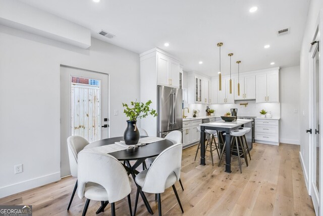 dining area with recessed lighting, baseboards, and visible vents