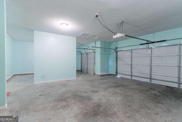garage featuring baseboards and a garage door opener