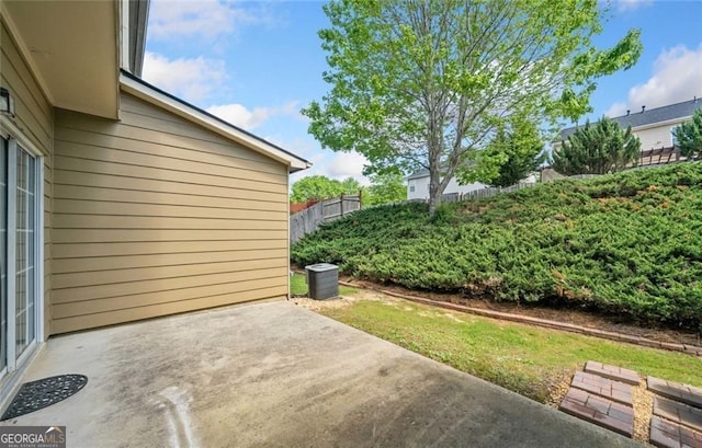 view of patio featuring fence