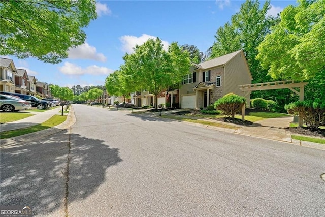 view of road featuring a residential view, sidewalks, and curbs