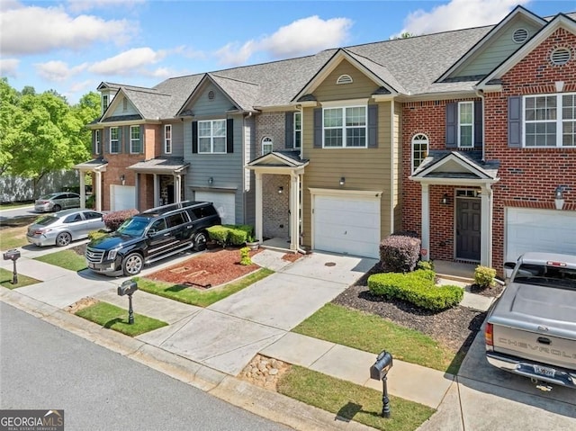 view of front of home featuring concrete driveway, brick siding, an attached garage, and a shingled roof