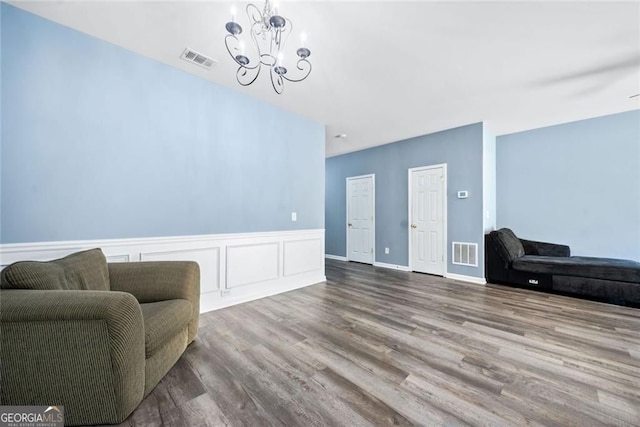 3366 Thornbridge Dr, Powder Springs, GA 30127 - living area featuring a notable chandelier, wood finished floors, and visible vents