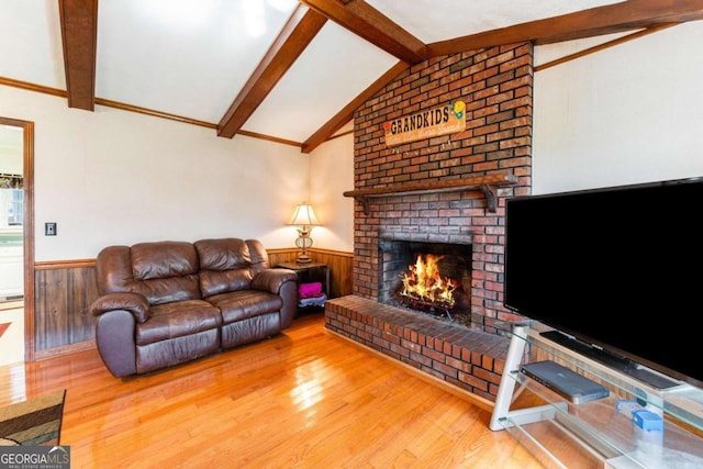 417 Pulliam Ln, Royston, GA 30662 - living area with wainscoting, a brick fireplace, and wood finished floors