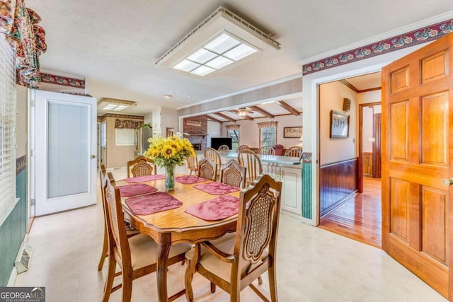 417 Pulliam Ln, Royston, GA 30662 - dining area with light floors, a ceiling fan, and crown molding