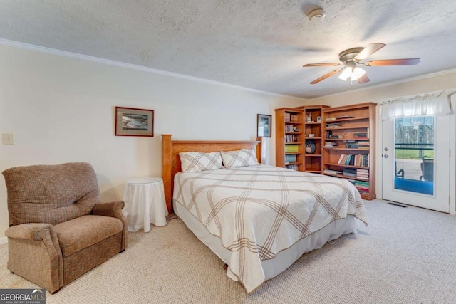 417 Pulliam Ln, Royston, GA 30662 - carpeted bedroom featuring a textured ceiling, visible vents, access to outside, ceiling fan, and ornamental molding
