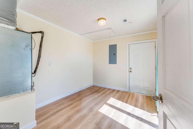 417 Pulliam Ln, Royston, GA 30662 - empty room with attic access, wood finished floors, a textured ceiling, and crown molding