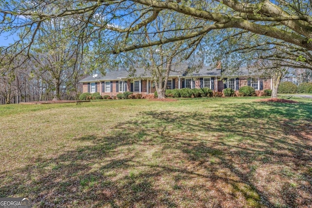 417 Pulliam Ln, Royston, GA 30662 - single story home with a chimney, a front lawn, and brick siding
