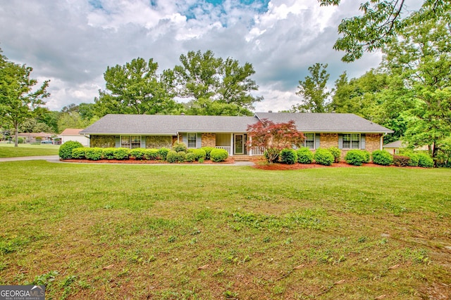 ranch-style house with a front lawn