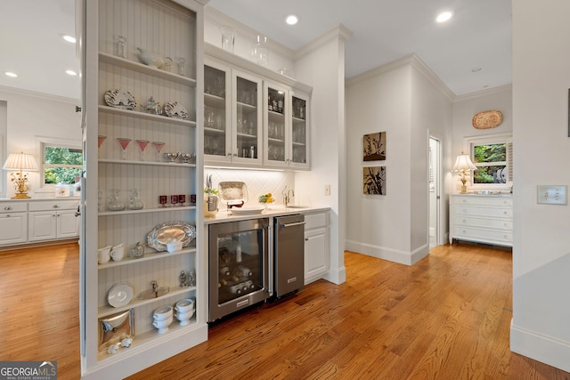 295 Goble Gap Rd, Clayton, GA 30525 - bar featuring beverage cooler, ornamental molding, healthy amount of natural light, light wood finished floors, and backsplash