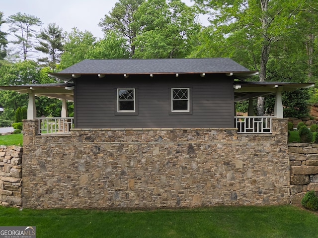 295 Goble Gap Rd, Clayton, GA 30525 - view of side of property with stone siding, a shingled roof, and a lawn