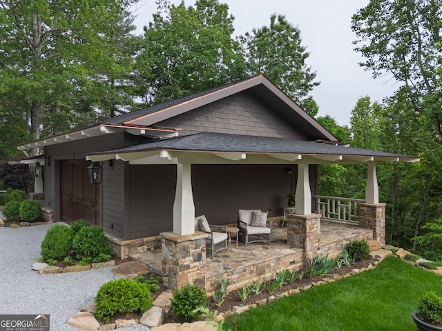 295 Goble Gap Rd, Clayton, GA 30525 - view of front of house with a porch, a shingled roof, and stone siding