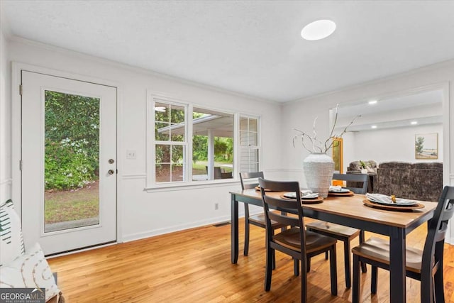 5766 Macland Rd, Powder Springs, GA 30127 - dining area with plenty of natural light, light wood-type flooring, and crown molding