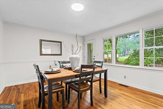 5766 Macland Rd, Powder Springs, GA 30127 - dining room featuring wood finished floors and ornamental molding