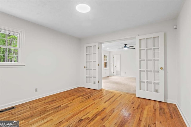 5766 Macland Rd, Powder Springs, GA 30127 - empty room featuring french doors, wood finished floors, and a ceiling fan