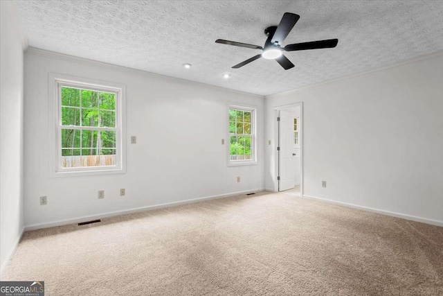 5766 Macland Rd, Powder Springs, GA 30127 - spare room featuring a ceiling fan, healthy amount of natural light, a textured ceiling, carpet, and ornamental molding