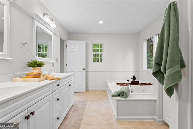 5766 Macland Rd, Powder Springs, GA 30127 - bathroom with double vanity, a garden tub, a wainscoted wall, tile patterned floors, and recessed lighting