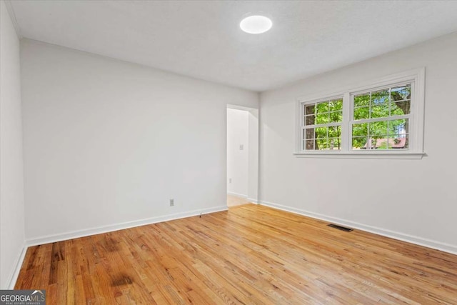 5766 Macland Rd, Powder Springs, GA 30127 - unfurnished room with baseboards and light wood-style flooring