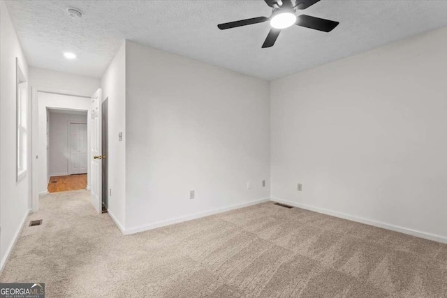 5766 Macland Rd, Powder Springs, GA 30127 - empty room with carpet flooring, a ceiling fan, a textured ceiling, and a smoke detector