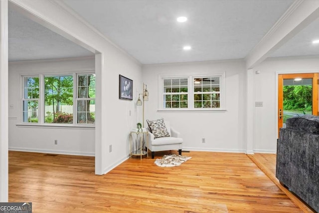 5766 Macland Rd, Powder Springs, GA 30127 - sitting room with light wood finished floors, crown molding, and recessed lighting