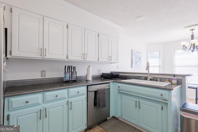 kitchen featuring a textured ceiling, dishwasher, a peninsula, and a sink