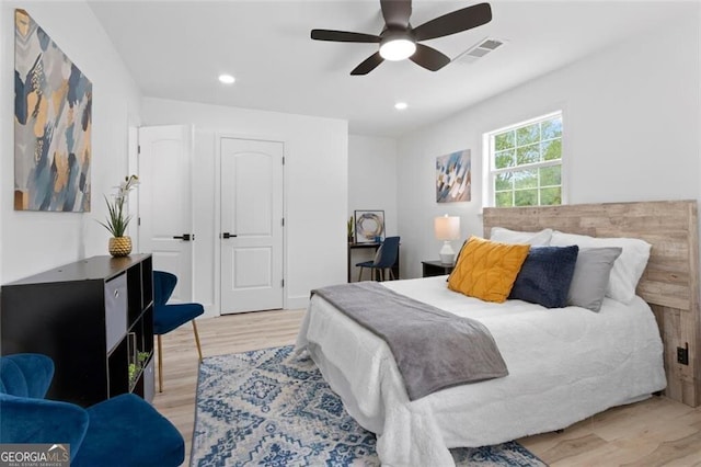 bedroom with visible vents, a ceiling fan, wood finished floors, and recessed lighting