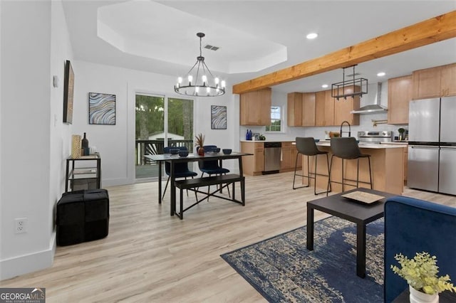 living area with baseboards, a notable chandelier, light wood-style floors, and recessed lighting