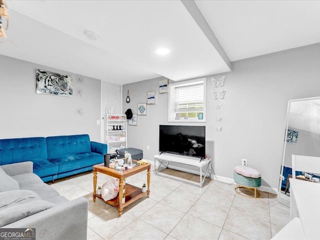 living room featuring light tile patterned floors and baseboards