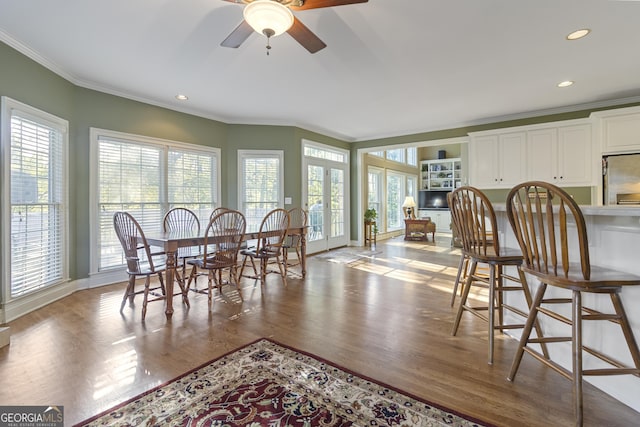 dining area featuring ceiling fan, a wealth of natural light, ornamental molding, and recessed lighting