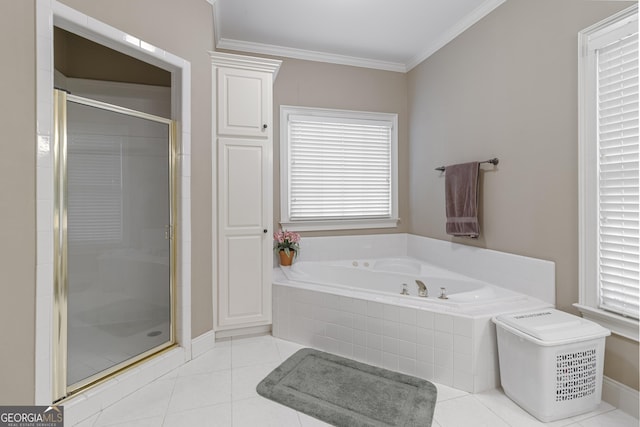 full bathroom featuring a bath, ornamental molding, tile patterned flooring, and a stall shower