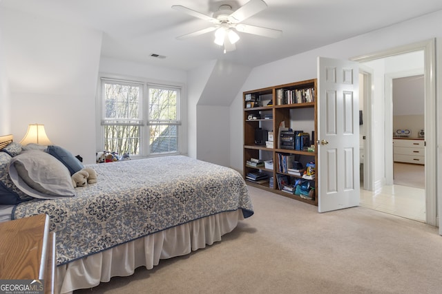 bedroom with ceiling fan, visible vents, and light colored carpet