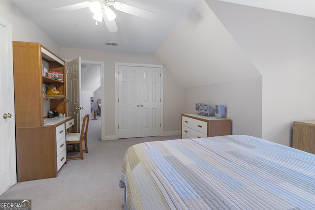 bedroom with lofted ceiling, visible vents, light carpet, a closet, and ceiling fan