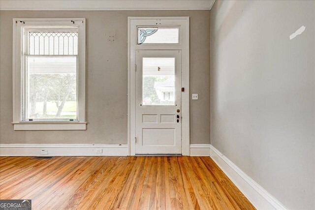 19 Mcdonough St, Hampton, GA 30228 - entrance foyer featuring wood finished floors, visible vents, and baseboards
