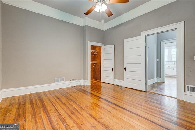 19 Mcdonough St, Hampton, GA 30228 - spare room featuring visible vents, ceiling fan, hardwood / wood-style floors, and baseboards