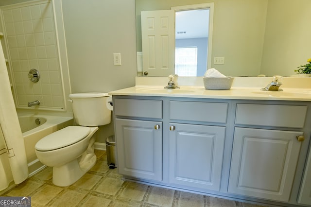 full bath with double vanity, visible vents, toilet, and a sink